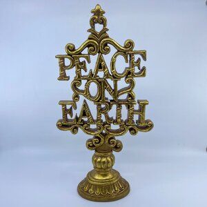 peace on earth gold colored resin tabletop sign